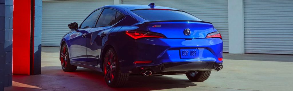 a blue 2026 Acura Integra is parked near a storage unit in Denver, CO